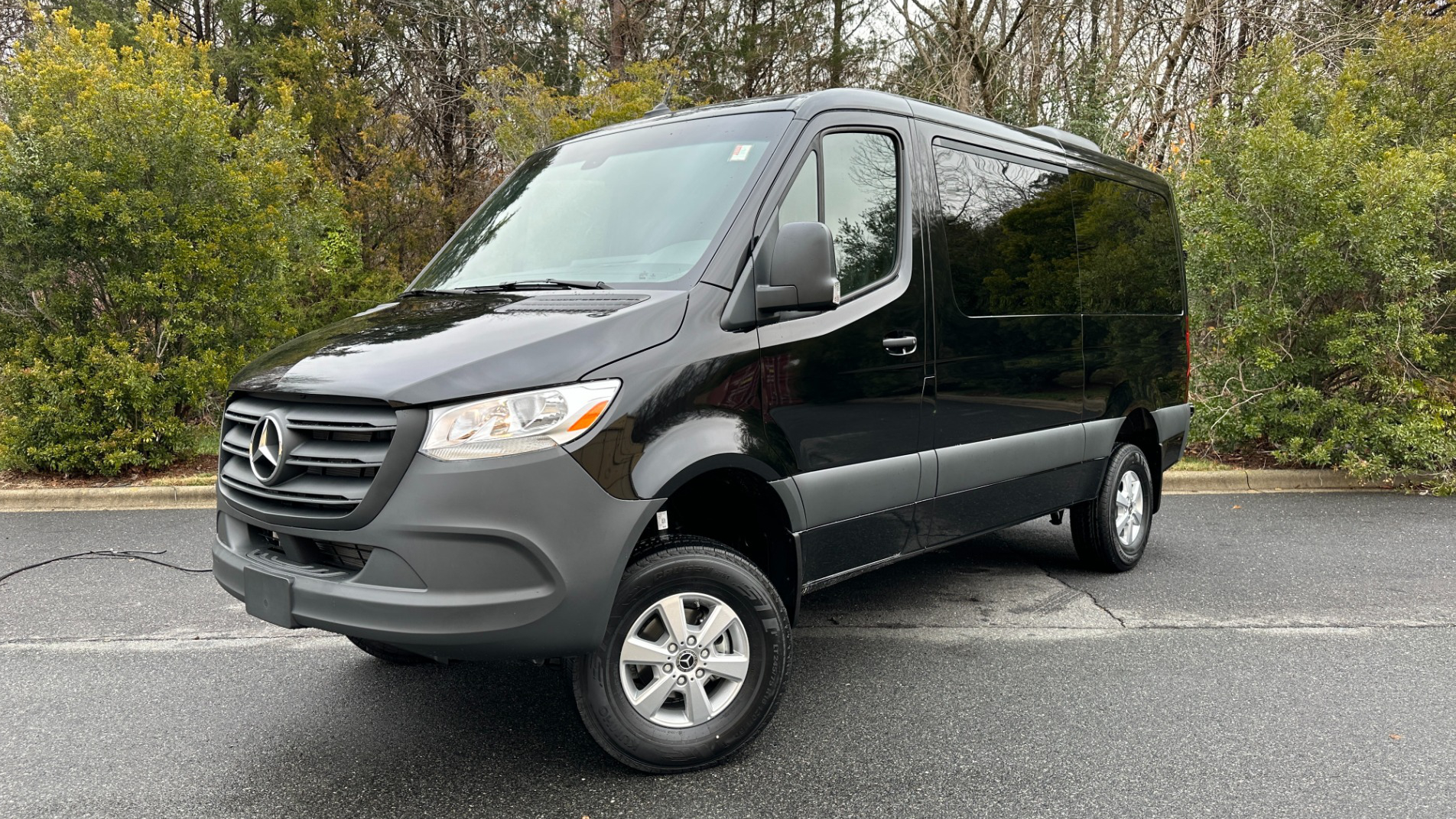 California Wine Tours black Mercedes-Benz Sprinter van parked outdoors, offering private wine tour transportation