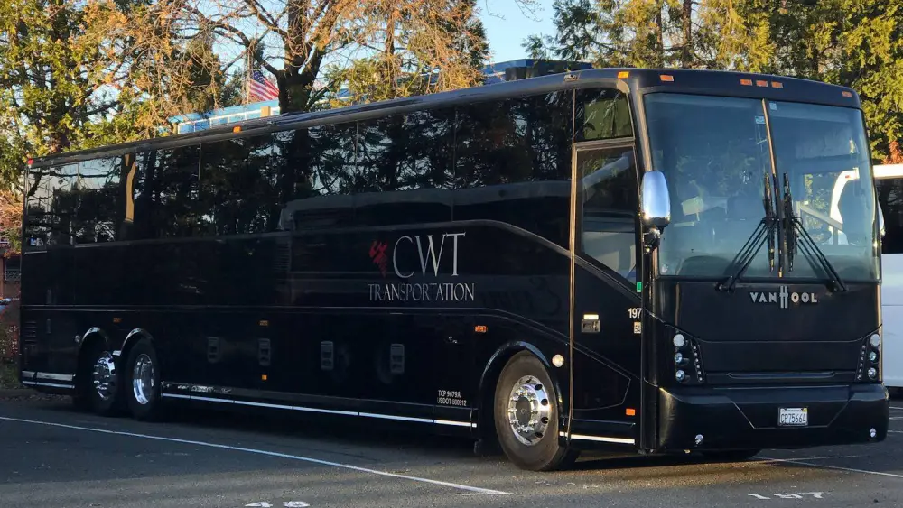 California Wine Tours black CWT luxury motorcoach parked outdoors, designed for large group wine tours and travel comfort