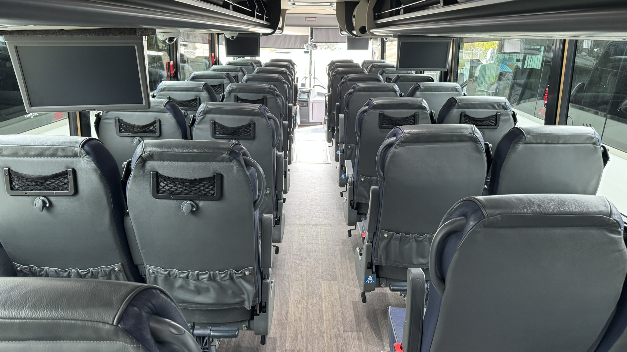 interior of Motor Coach showing seats in rows