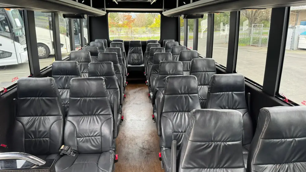California Wine Tours coach interior featuring wide rows of cushioned seats and ample space for group transport