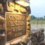 Sign for Gundlach Bundschu Winery, established in 1858, featuring the winery's name and logo.