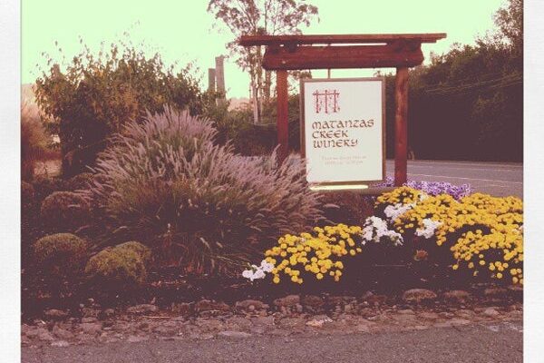 A sign that reads "McKinley Winery," situated in Matanzas, showcasing the winery's branding.
