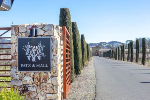 A road sign displaying "bat & ball" near Patz & Hall winery, indicating a recreational area or sports facility.