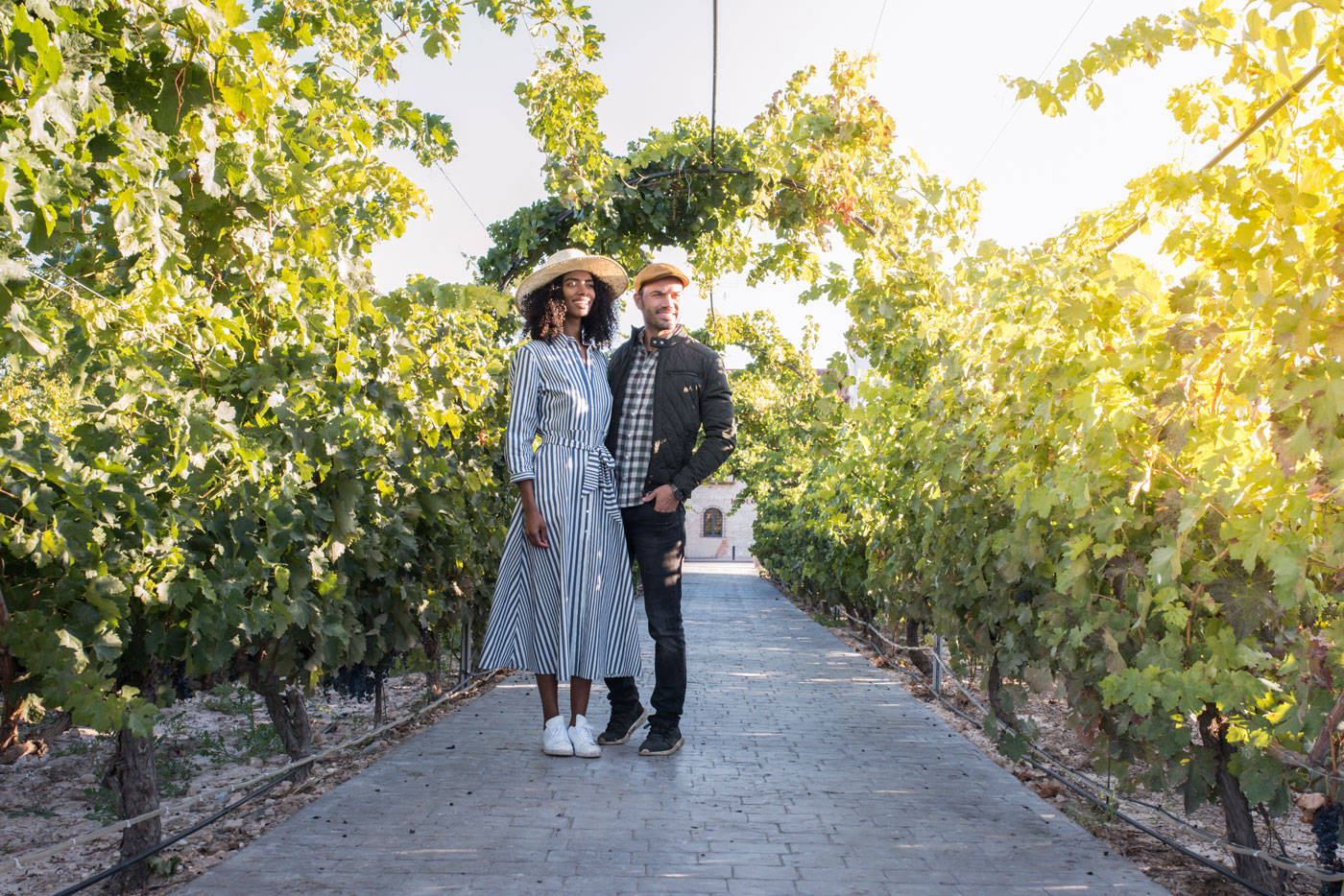 couple smiling in vineyard
