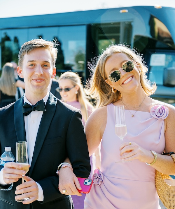 couple smiling holding champagne