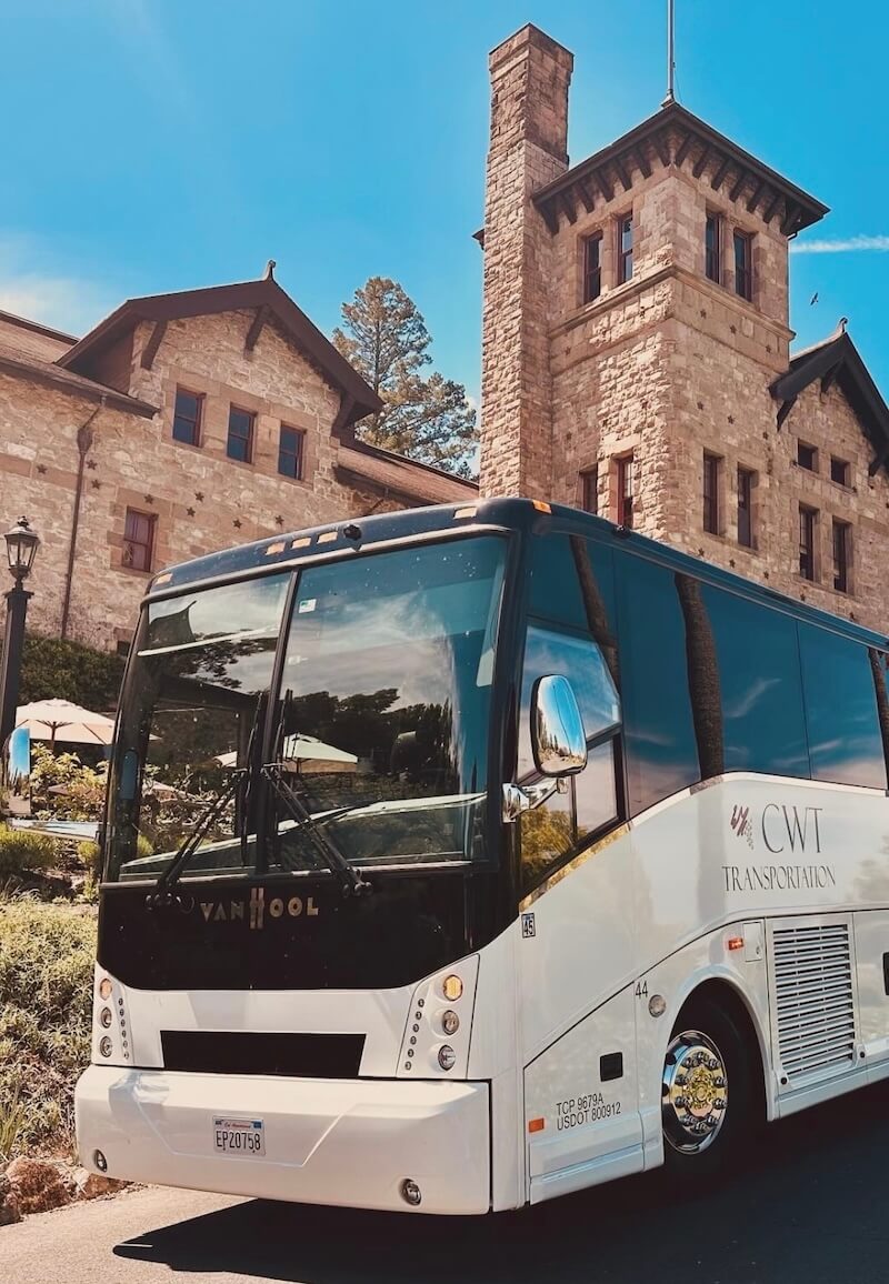 wine country tour of charter bus in front of a castle