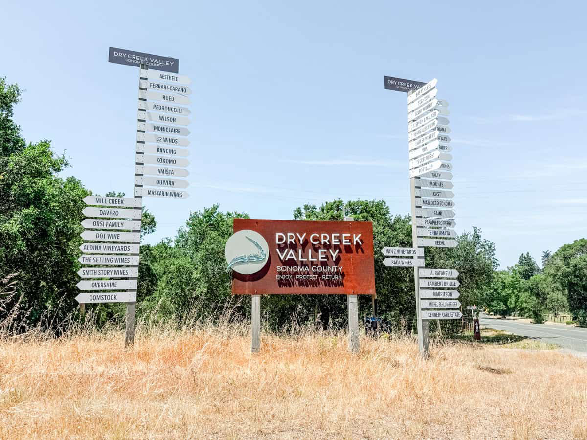 Healdsburg-Wine-Tour-Itinerary-Dry-Creek-Russian-River-in-One-Day-featured-image sign of Dry creek wineries at dry creek road